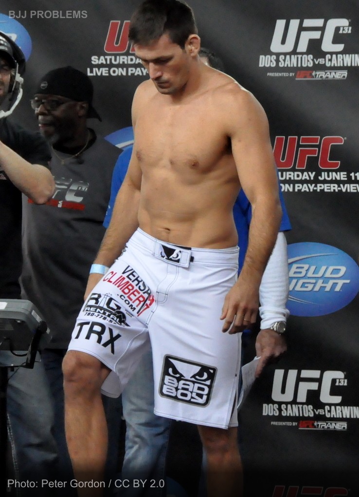 Man Who 'Trains UFC' Cannot Explain What Acronym Stands For, Attempts Standing Guillotine On Seated Partner